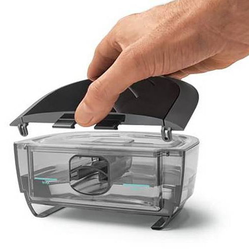 Hand opening a dream station 2 water tank lid