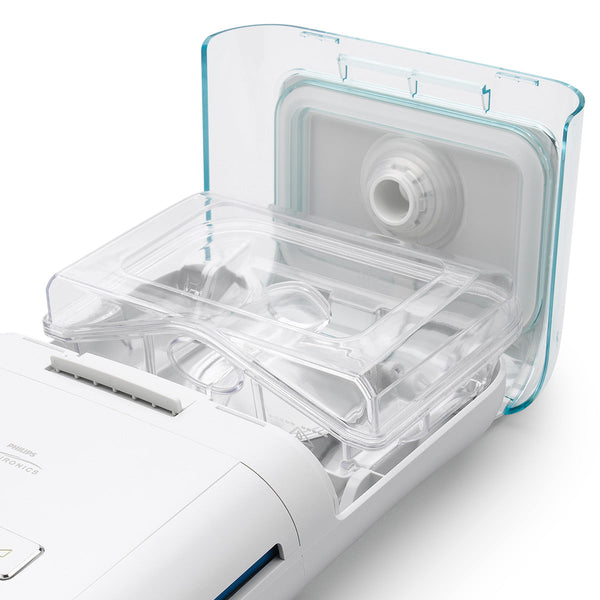 Clear plastic component of a medical device on a white background