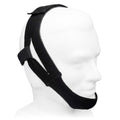 Black head gear on a mannequin head against a white background