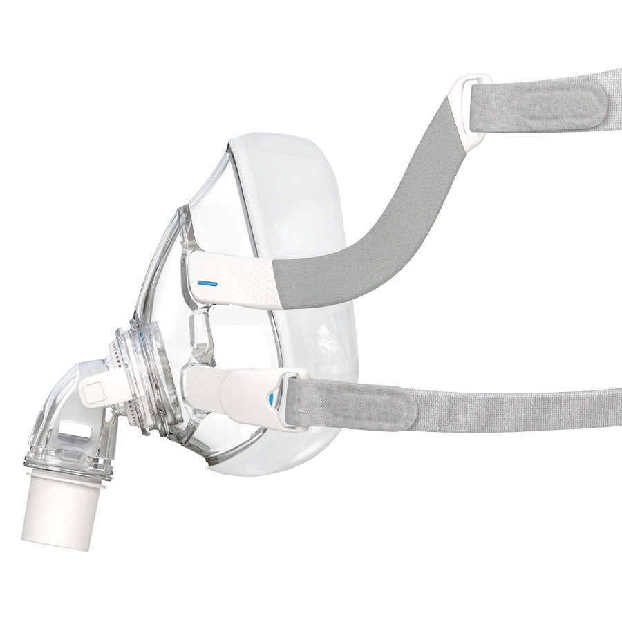 CPAP mask with clear facepiece and gray headgear on a white background
