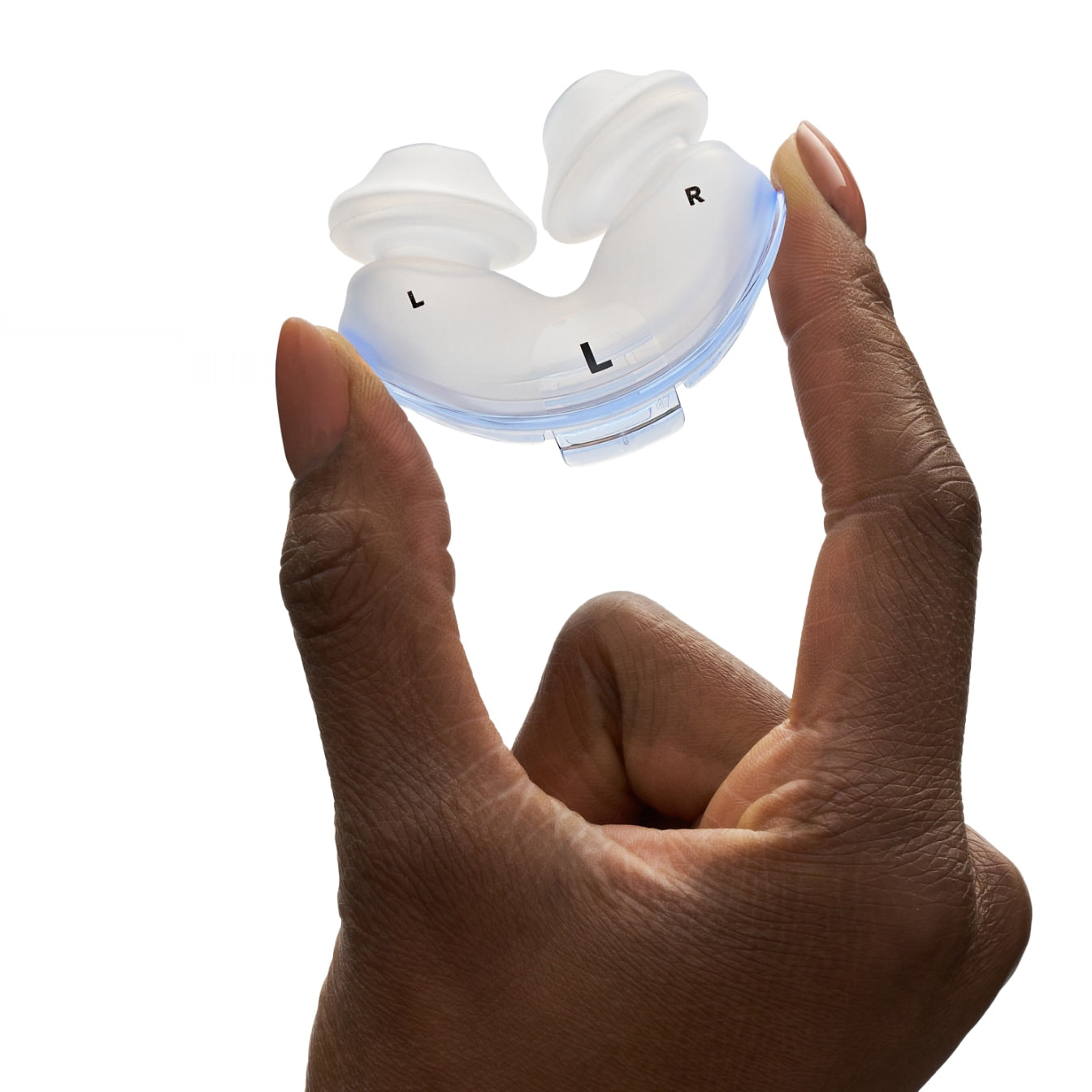 Person holding AirFit P10 cushion with size markings visible