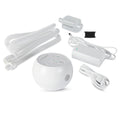 The image shows the Transcend Micro Portable Auto-CPAP Machine, which is white and light grey in color. It includes the main device, an adjustable hose, various connectors, a power adapter, and a carrying case.
